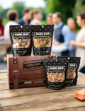 Build Your Own 4-Pack Box Mixed Nuts with Damn, Man Snacks on display at an outdoor gathering. Protein-packed gourmet nut snack box. Perfect for Fathers Day Gift or gifts for him