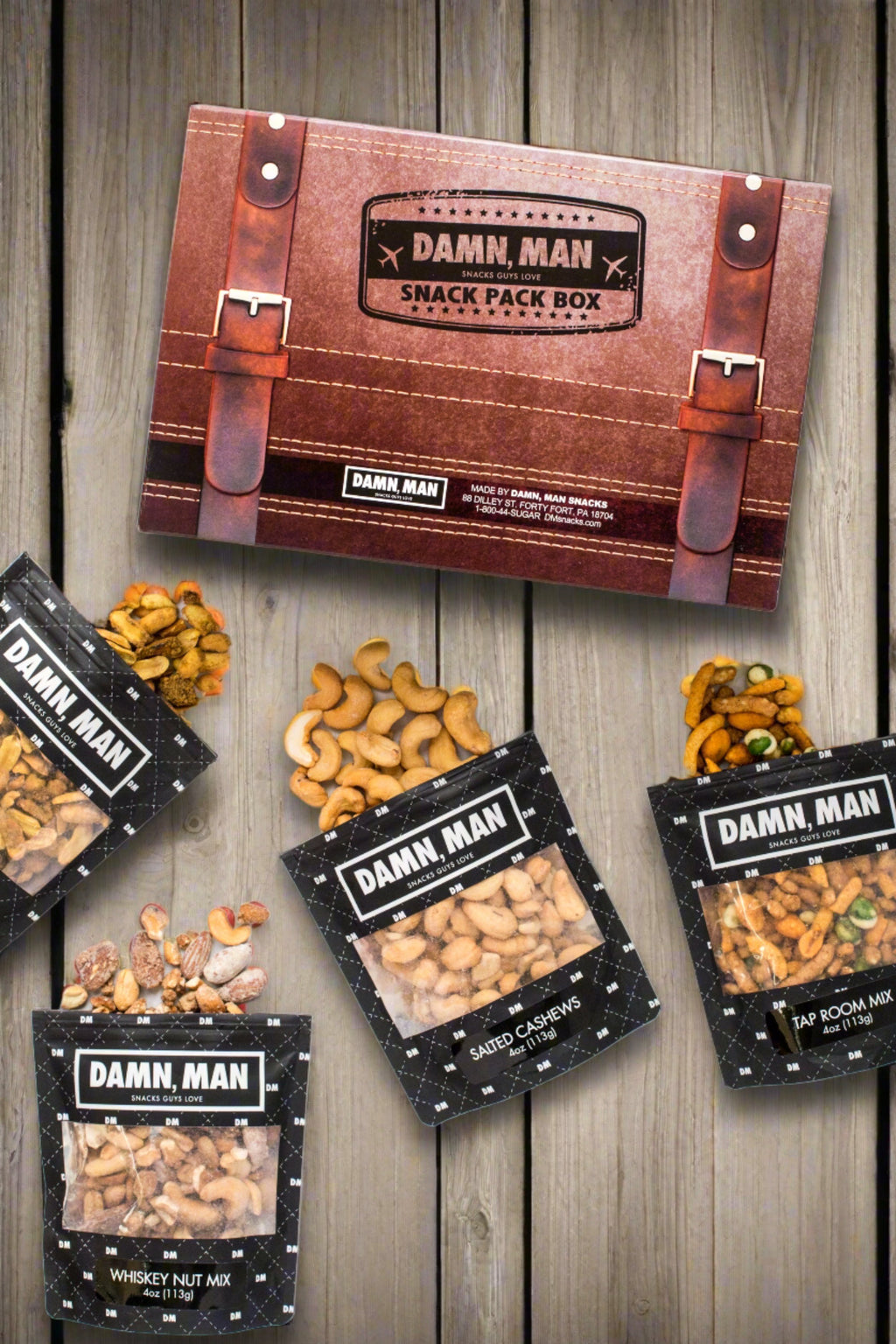 Build Your Own 4-Pack Box Mixed Nuts - Damn, Man Snacks featuring whisky nut mix, salted cashews, tap room mix, and roasted peanuts.