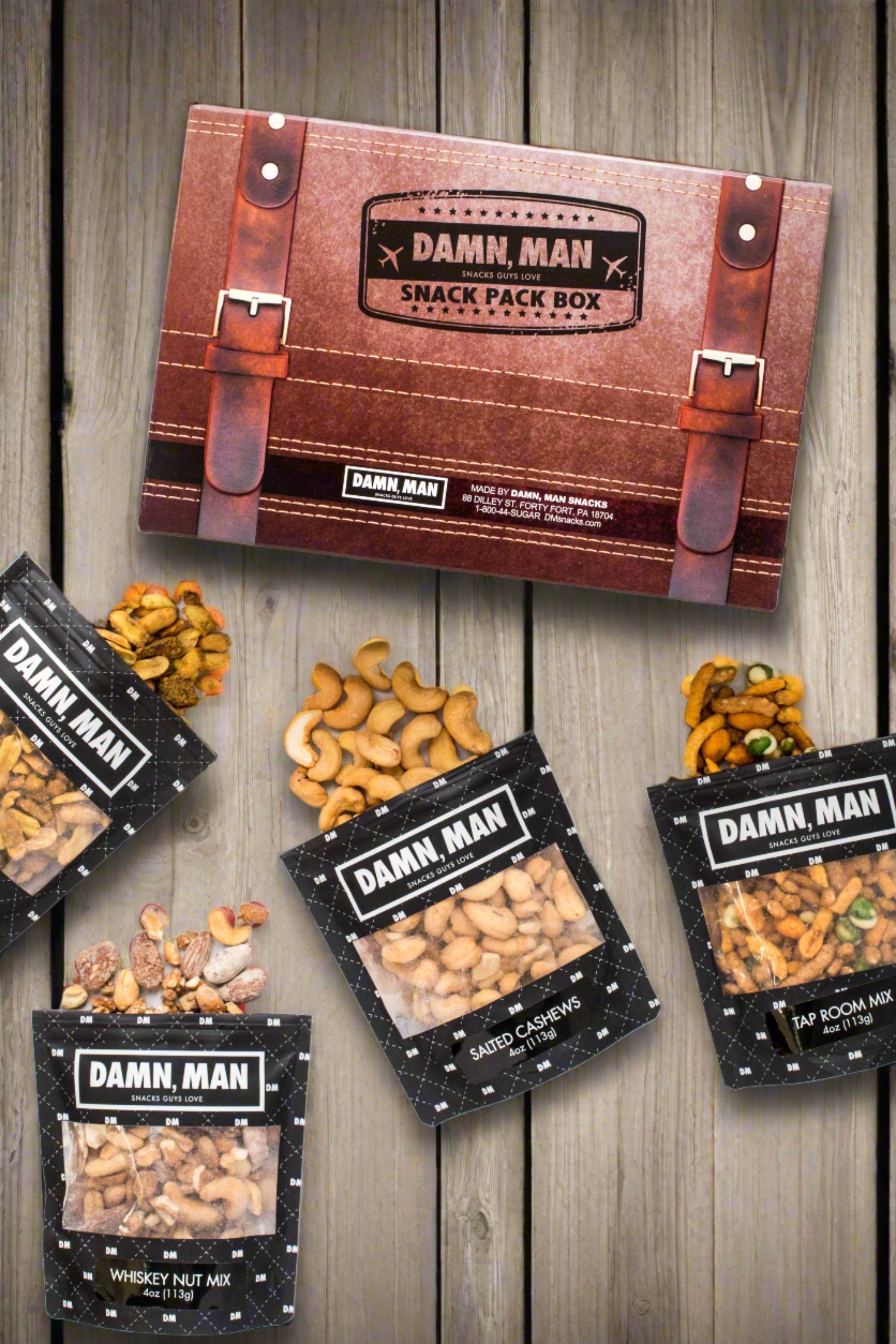 Build Your Own 4-Pack Box Mixed Nuts - Damn, Man Snacks featuring whisky nut mix, salted cashews, tap room mix, and roasted peanuts.