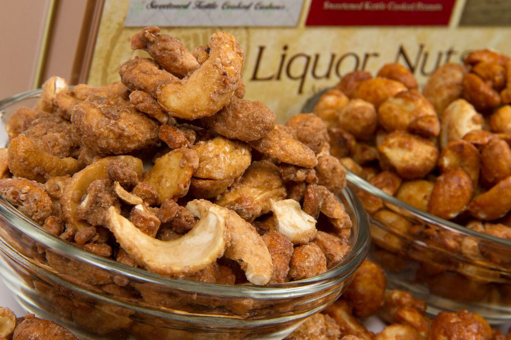 Assorted Beer & Bourbon Liquor Nuts Gift Tin with flavorful cashews, peanuts, and almonds in a glass bowl, perfect men's snack gift.